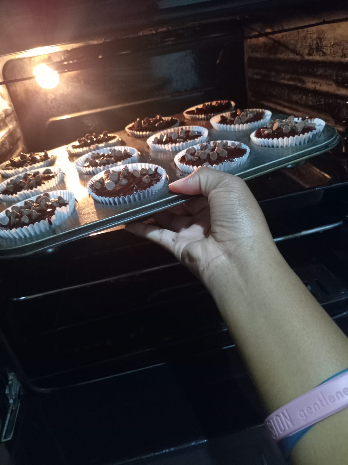 Chocolate muffins baking in the oven